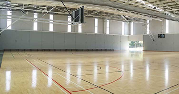 Separation of the two courts can be done with a full length drop curtain if required.
